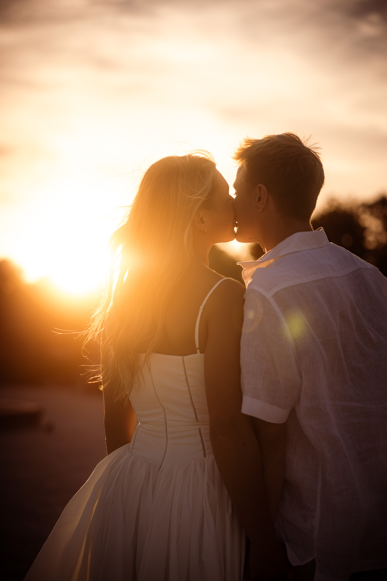 Sunset kiss after the proposal in Paris