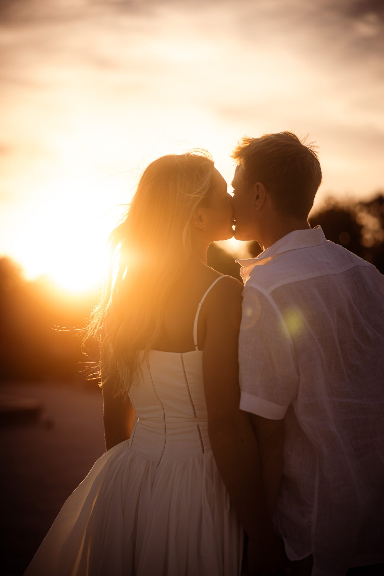 Sunset kiss after the proposal in Paris