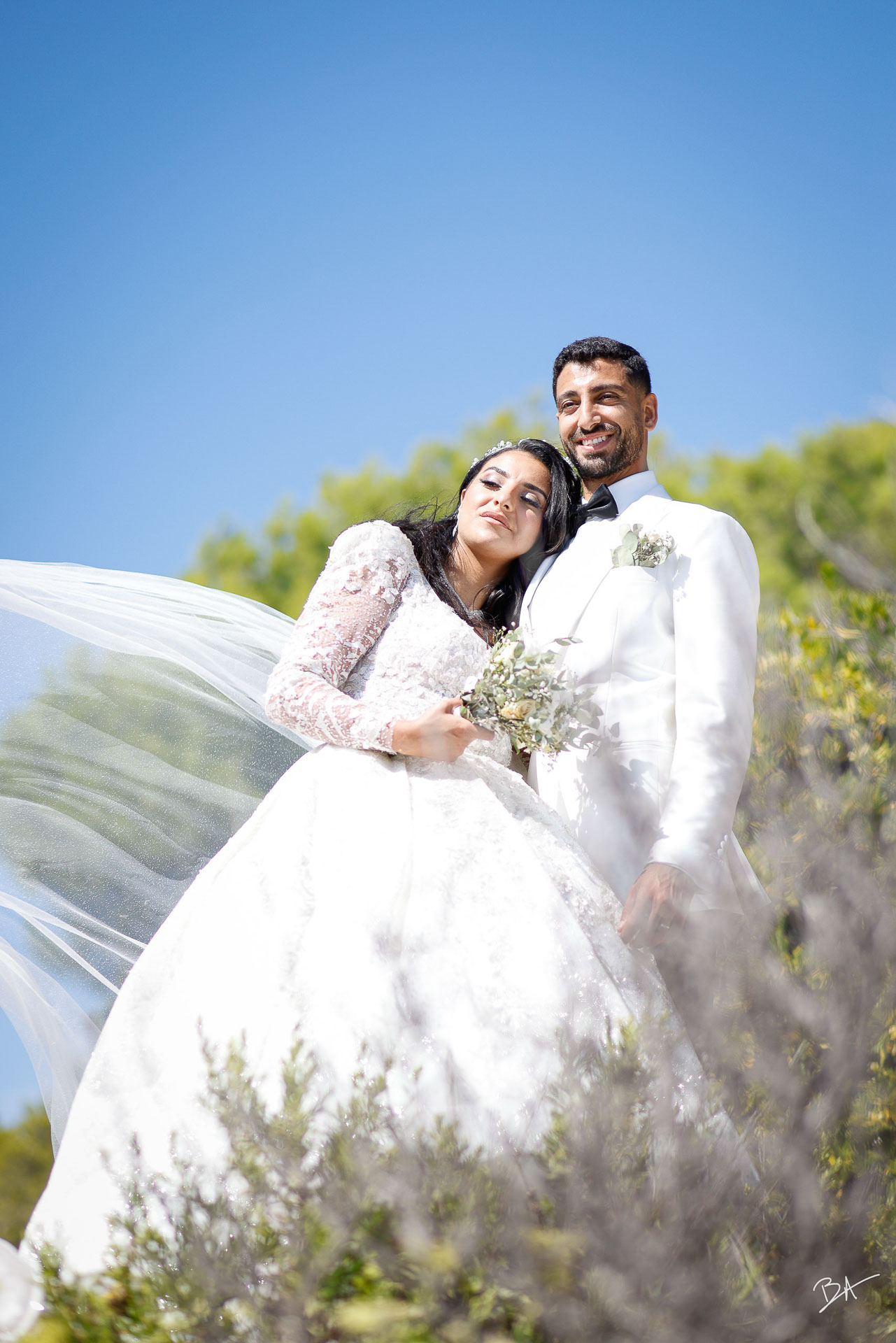 Couple portrait with flowing veil on the Riviera hills