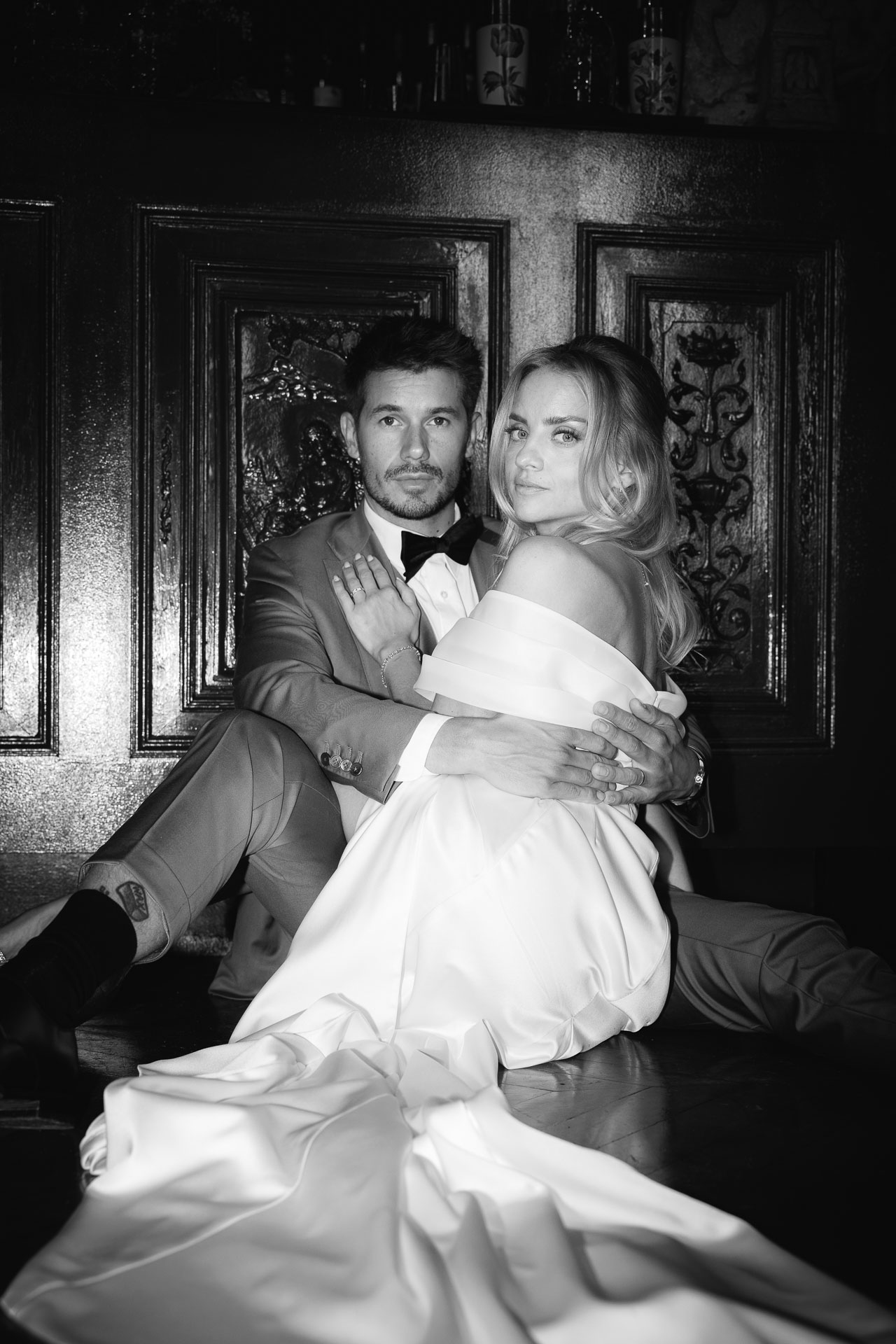 Editorial bride and groom portrait by a pond in France